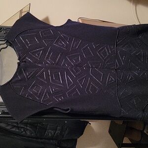 Black dress with embossed pattern
